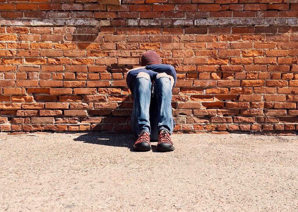 Young man experiencing sadness.